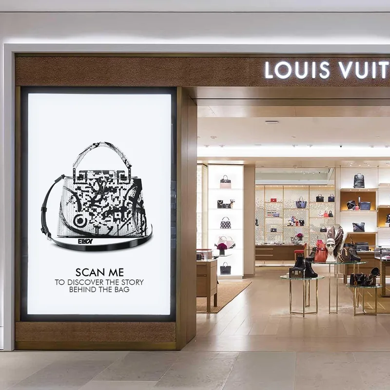 Louis Vuitton ArtQrCode® displayed in a boutique: scan me to discover the story behind the bag