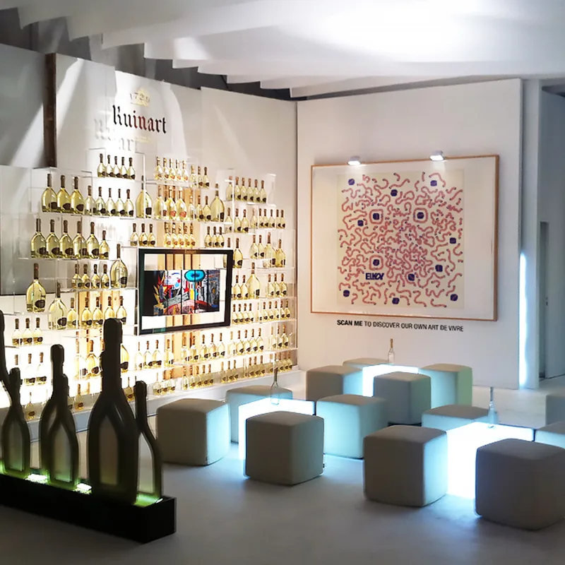 Ruinart ArtQrCode® framed in a champagne tasting room