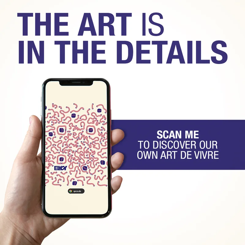 A phone scanning the Ruinart ArtQrCode® framed in a tasting room